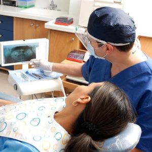 Doctor with patient looking at screen